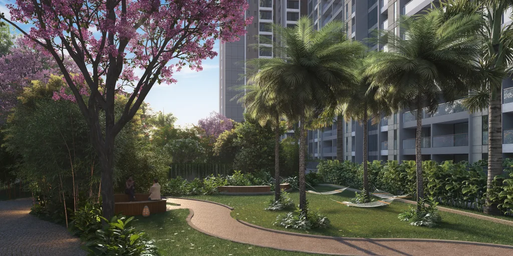 Landscaped garden walkway with palms and blossoming trees at Pristine O2 World